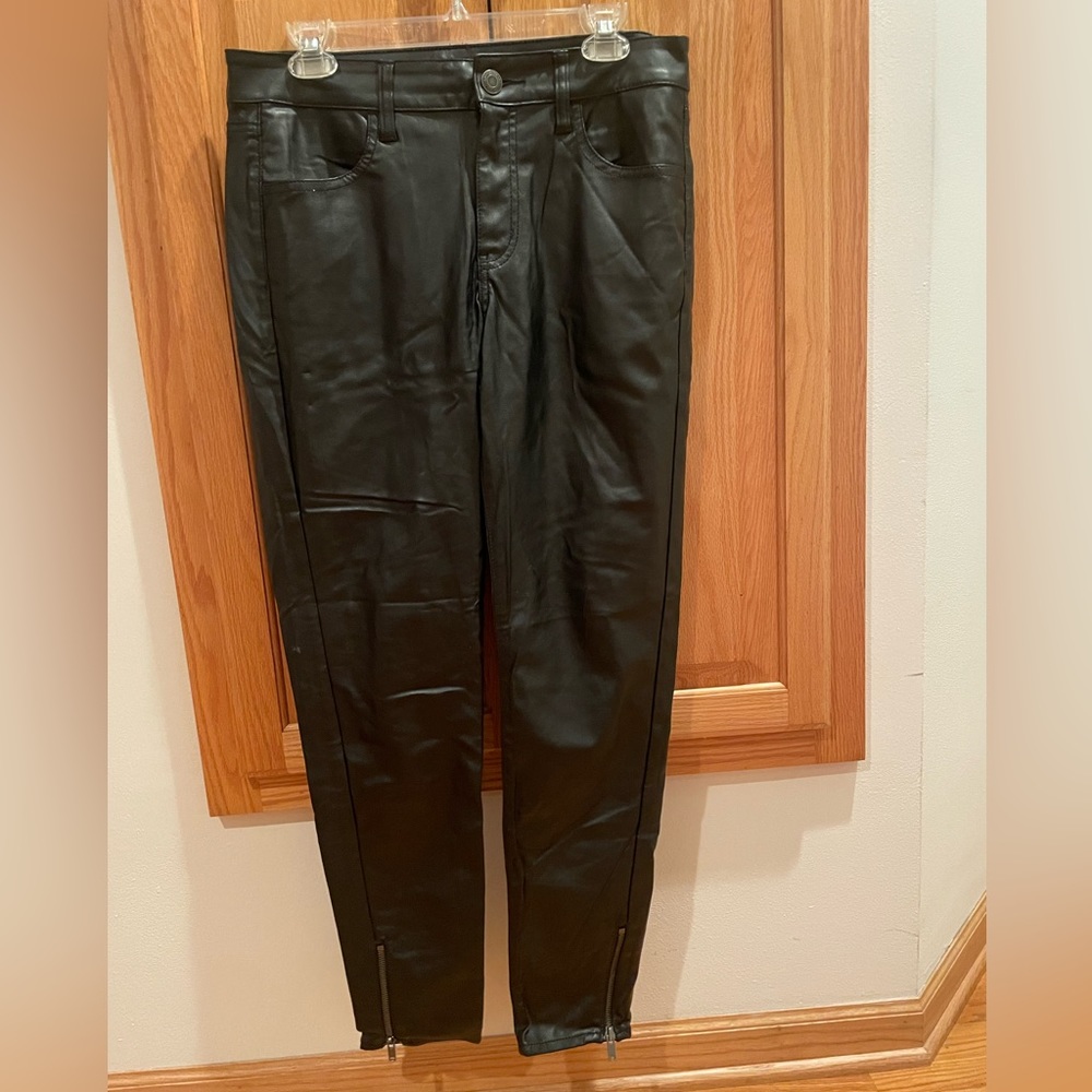 Bebe size large. Worn once. 100% polyurethane black leggings.